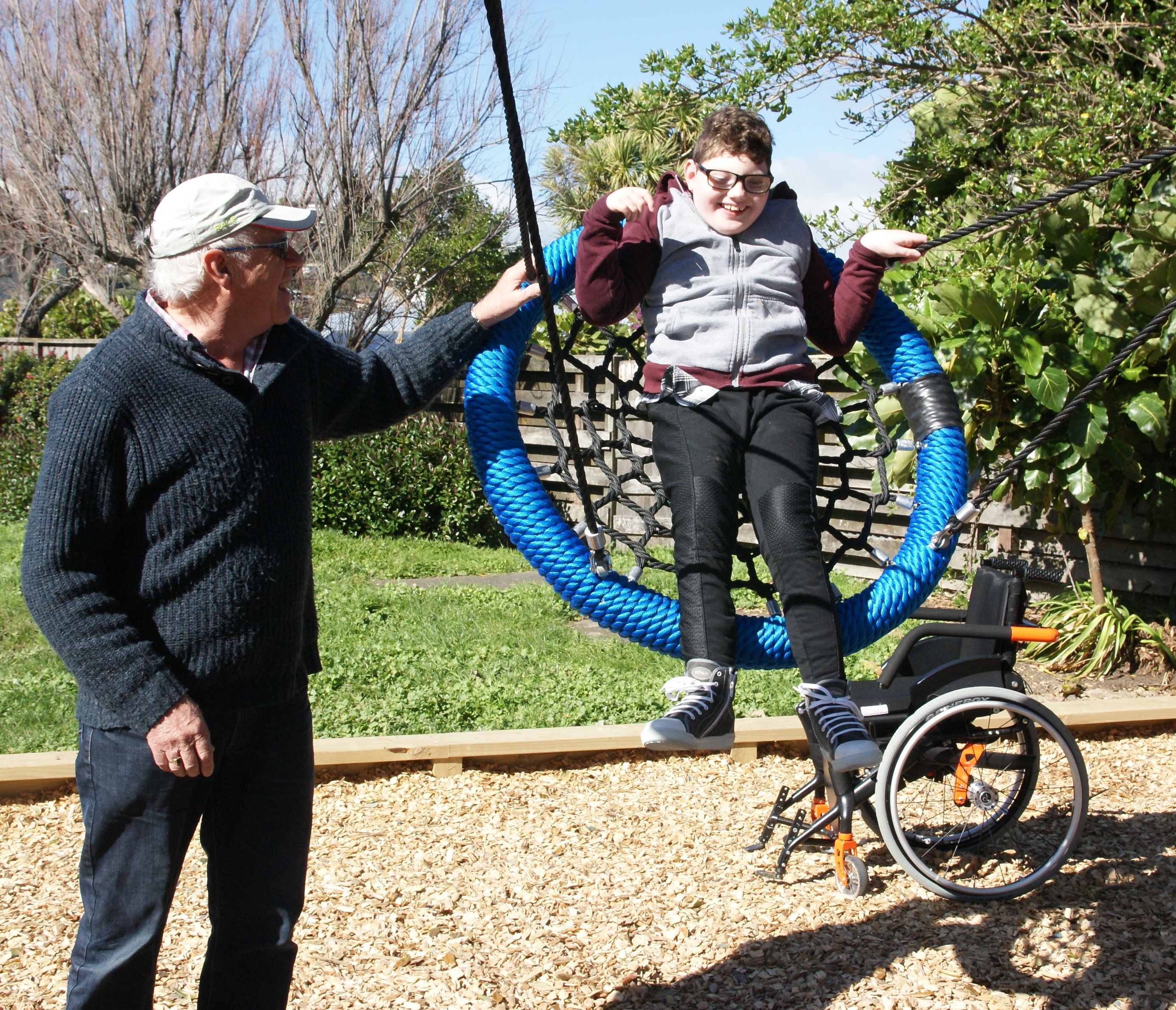 Child swinging high on a swing